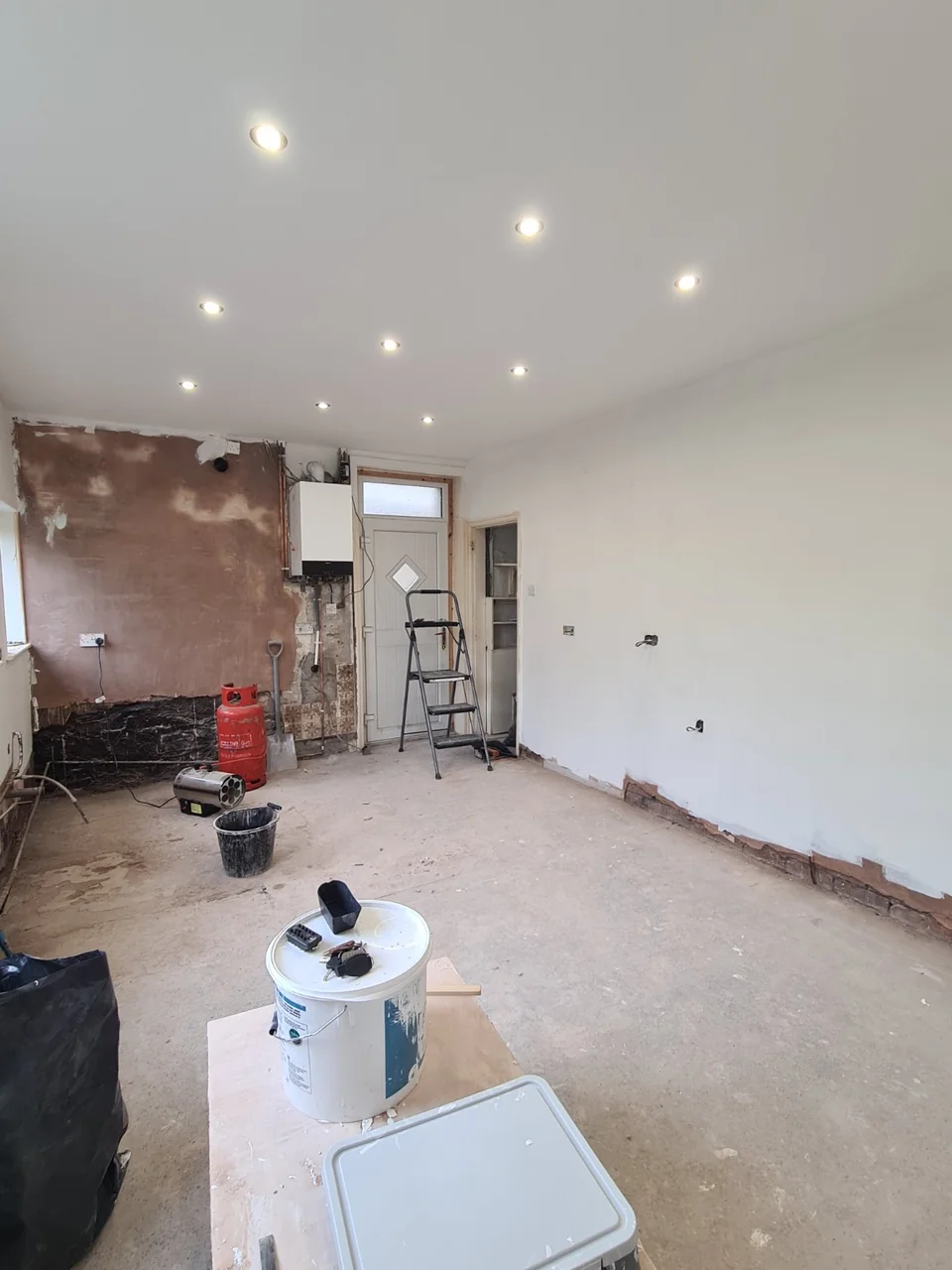 White walls and ceiling with recessed lights during the Rawtenstall kitchen refurbishment.