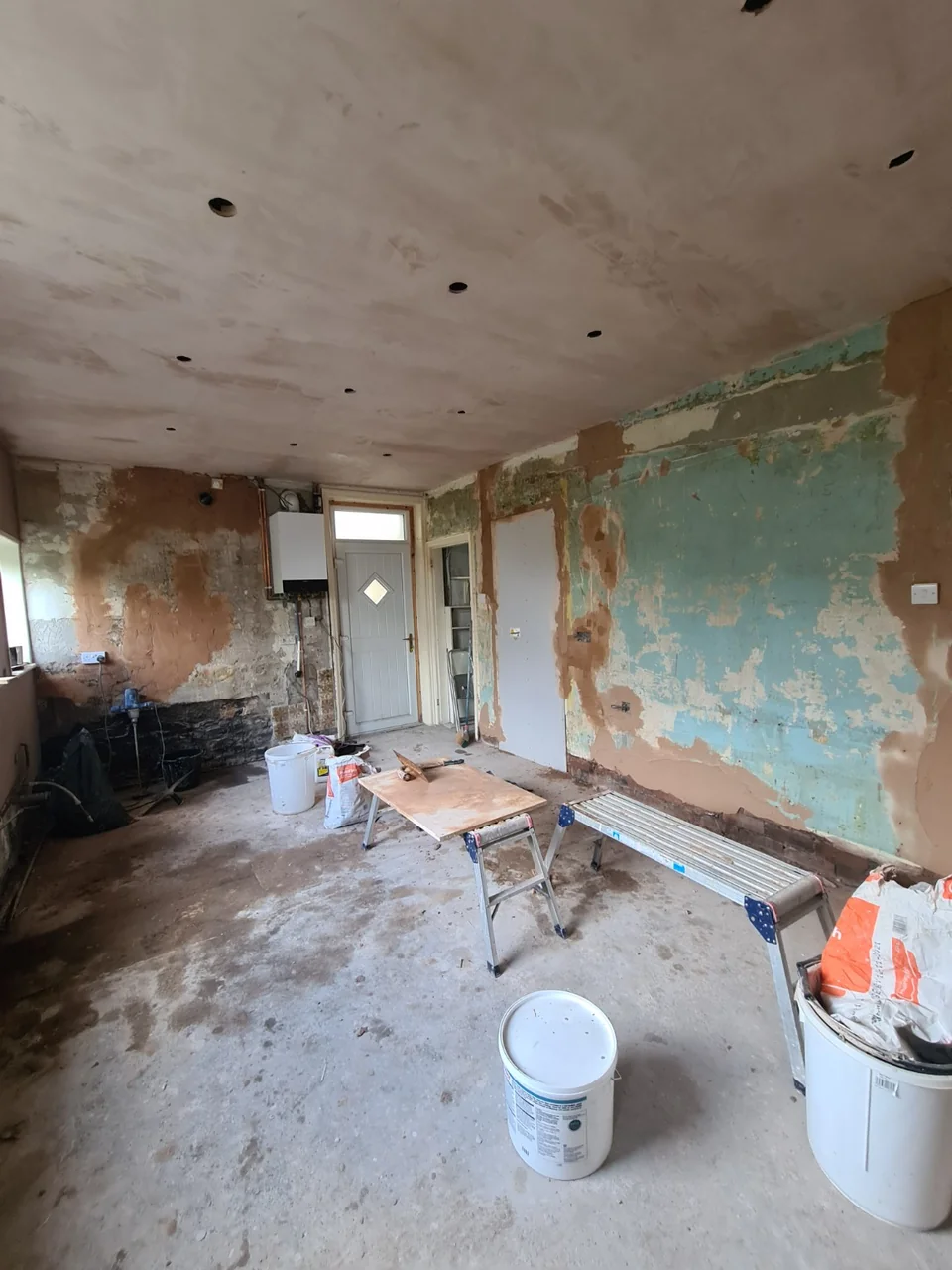 Exposed and prepared wall surfaces in the Rawtenstall kitchen before the new installation.
